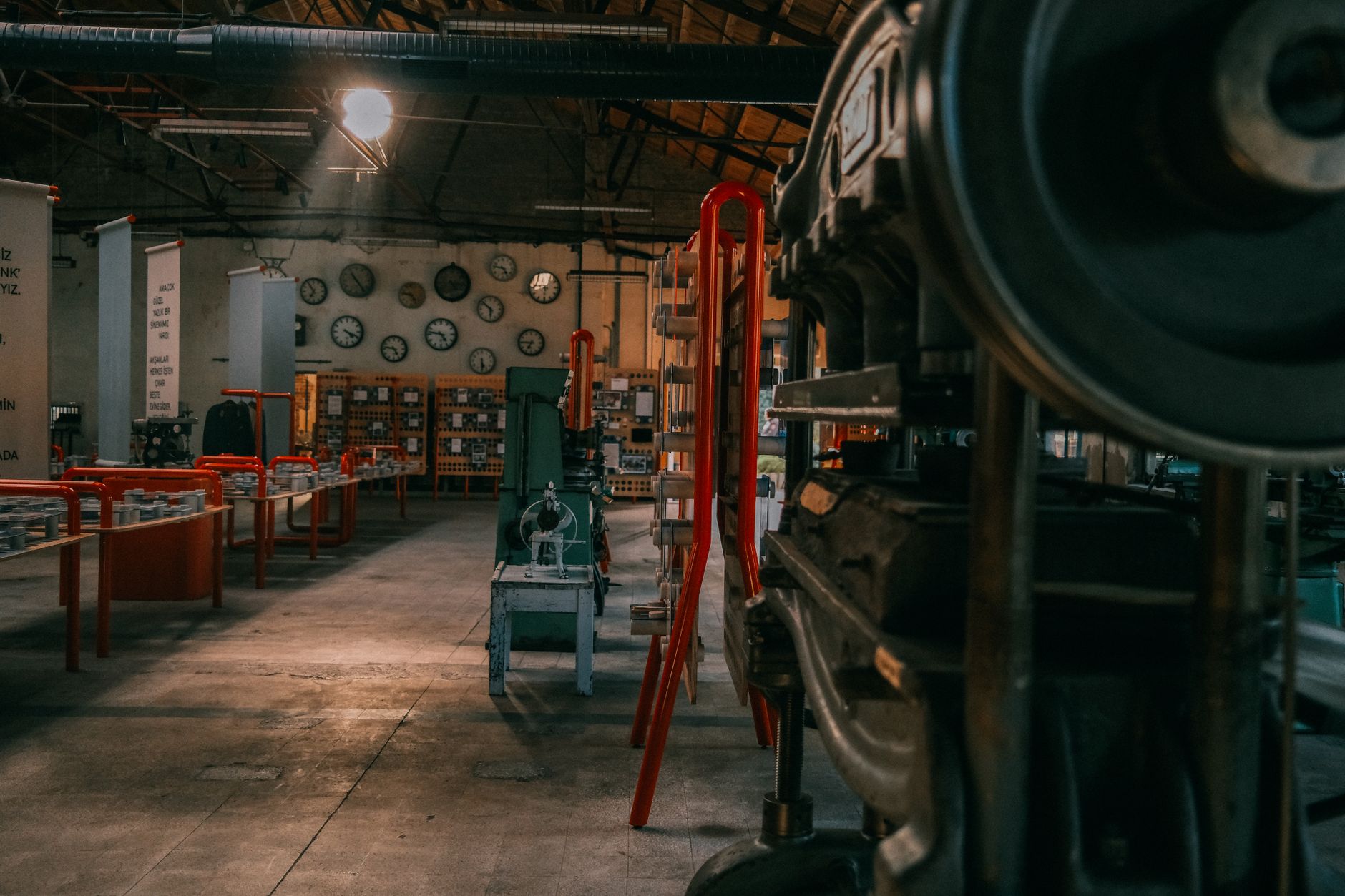 A workshop interior with machinery and tools arranged along a work wall